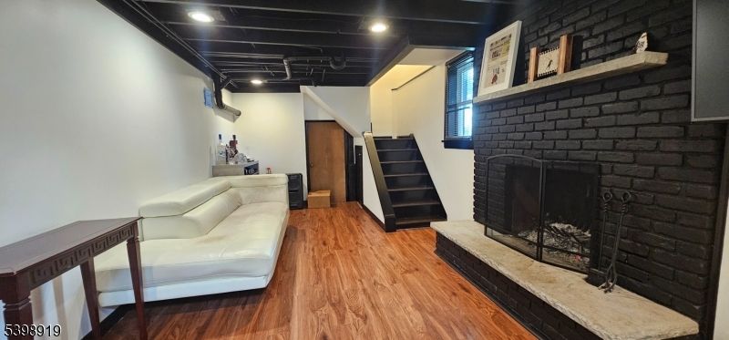 Fireplace, Interior, Recessed Lighting, Stone Walls, Wood Texture Flooring