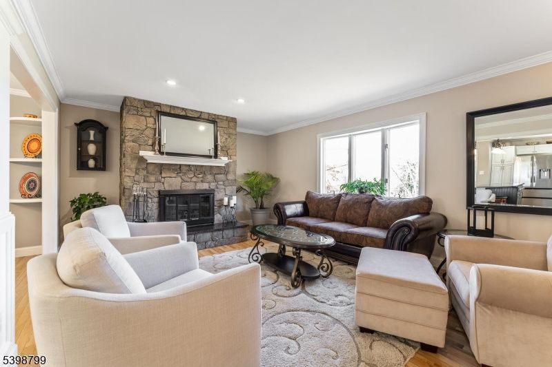 Fireplace, Interior, Living room, Recessed Lighting, Stone Walls, Wood Texture Flooring