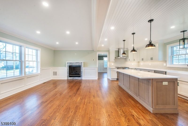 Empty room, Fireplace, Interior, Kitchen, Pendant Lights, Recessed Lighting, Wood Texture Flooring