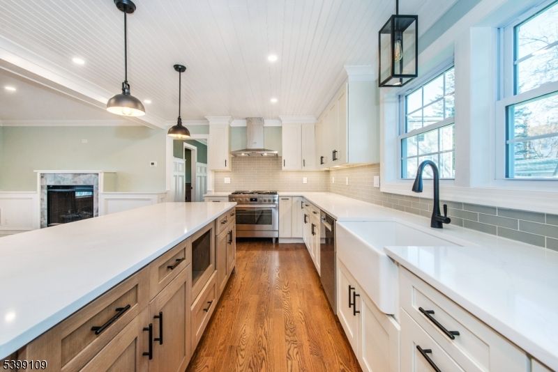 Fireplace, Interior, Kitchen, Pendant Lights, Recessed Lighting, Stainless Steel Appliances, Wood Texture Flooring