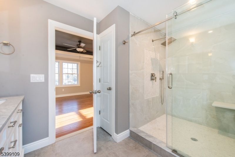 Bathroom, Glass Shower, Interior, Marble Walls, Recessed Lighting, Wood Texture Flooring