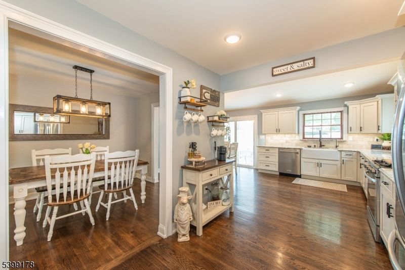 Dining room, Interior, Kitchen, Pendant Lights, Recessed Lighting, Stainless Steel Appliances, Wood Texture Flooring