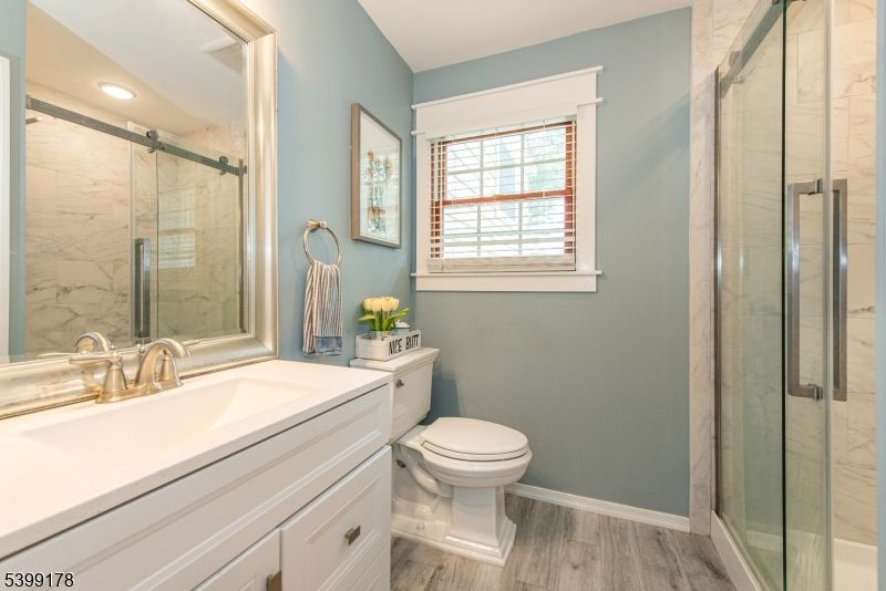 Bathroom, Glass Shower, Interior, Marble Walls, Recessed Lighting, Wood Texture Flooring