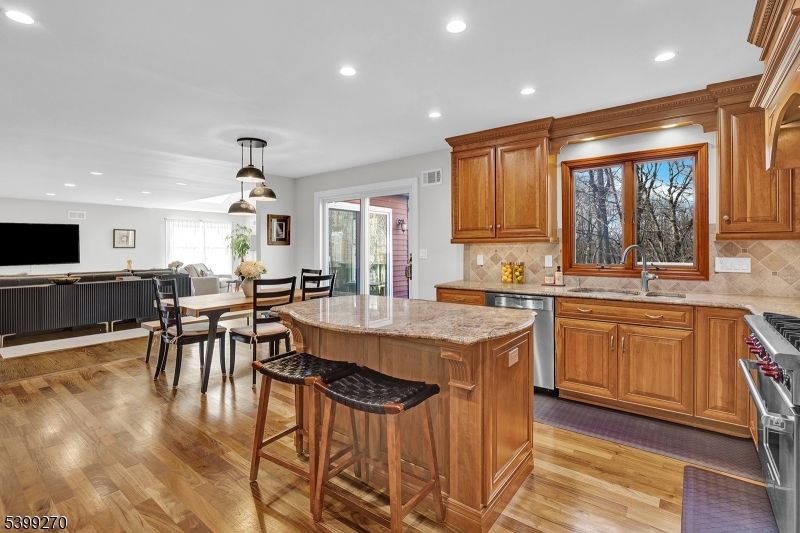 Dining room, Interior, Kitchen, Living room, Pendant Lights, Recessed Lighting, Stainless Steel Appliances, Wood Texture Flooring