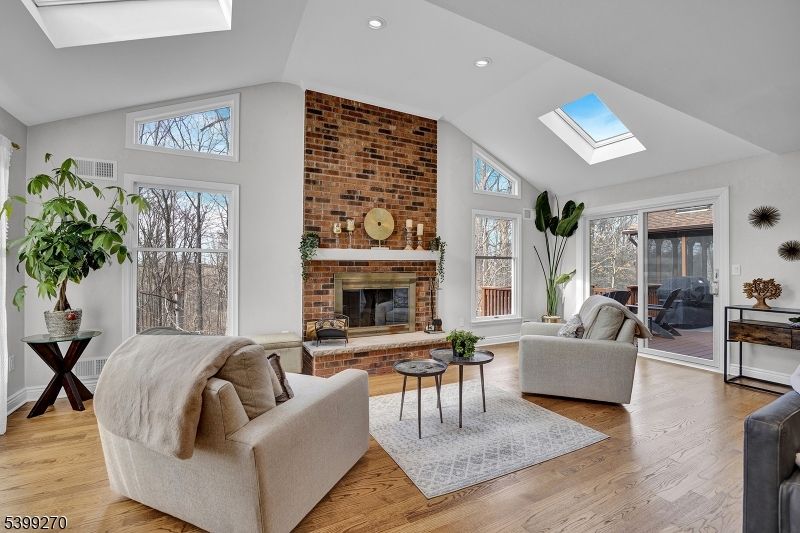 Fireplace, Interior, Living room, Recessed Lighting, Stone Walls, Wood Texture Flooring