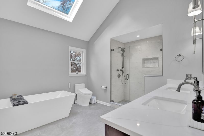 Bathroom, Dual Sink Vanities, Free Standing Baths, Glass Shower, Interior, Marble Walls, Recessed Lighting