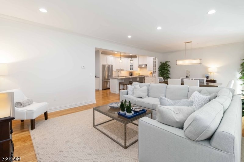 Dining room, Interior, Kitchen, Living room, Pendant Lights, Recessed Lighting, Stainless Steel Appliances, Wood Texture Flooring