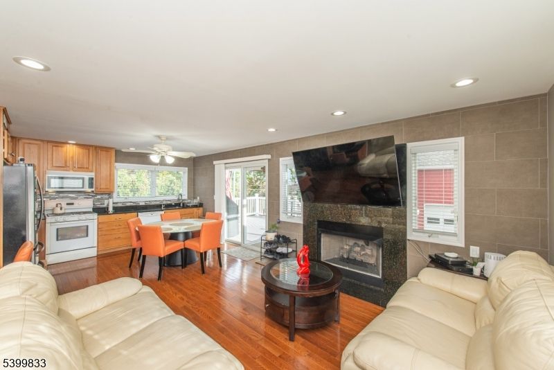 Dining room, Fireplace, Interior, Kitchen, Living room, Recessed Lighting, Wood Texture Flooring