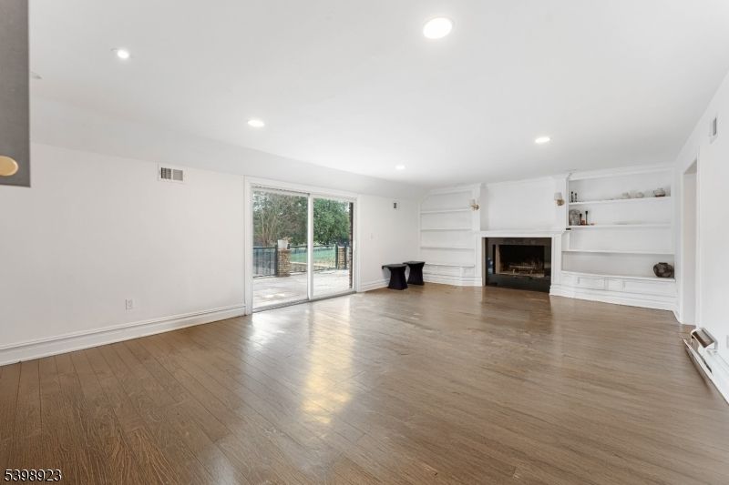 Empty room, Fireplace, Interior, Recessed Lighting, Wood Texture Flooring