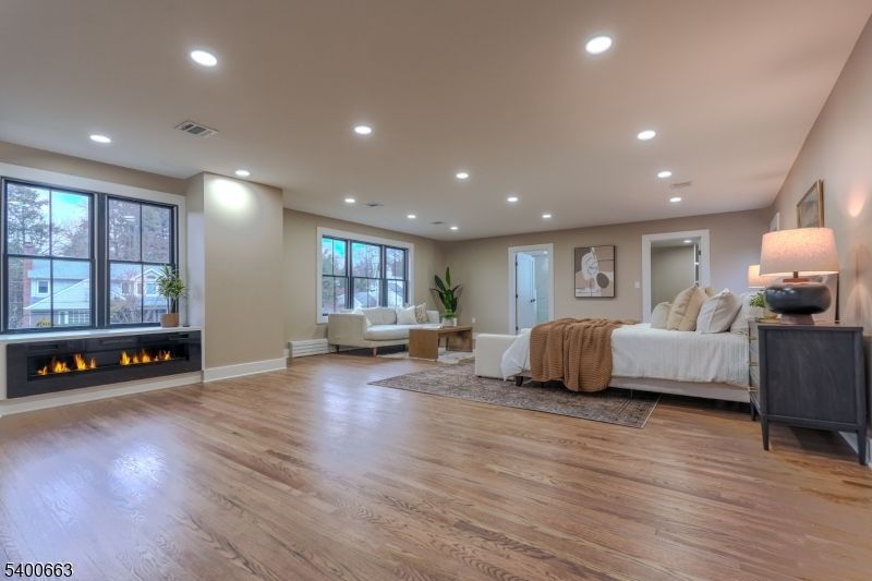 Bedroom, Fireplace, Interior, Living room, Recessed Lighting, Wood Texture Flooring