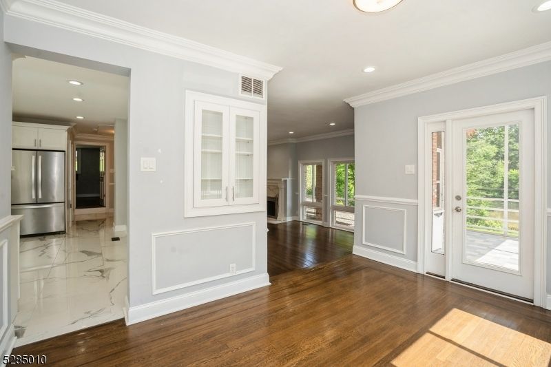 Empty room, Interior, Kitchen, Marble, Recessed Lighting, Stainless Steel Appliances, Wood Texture Flooring