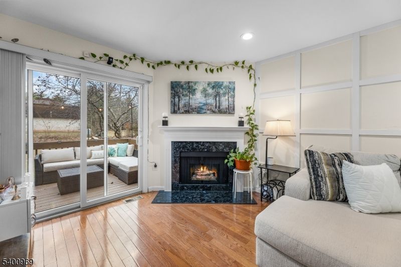 Bedroom, Fireplace, Interior, Recessed Lighting, Wood Texture Flooring