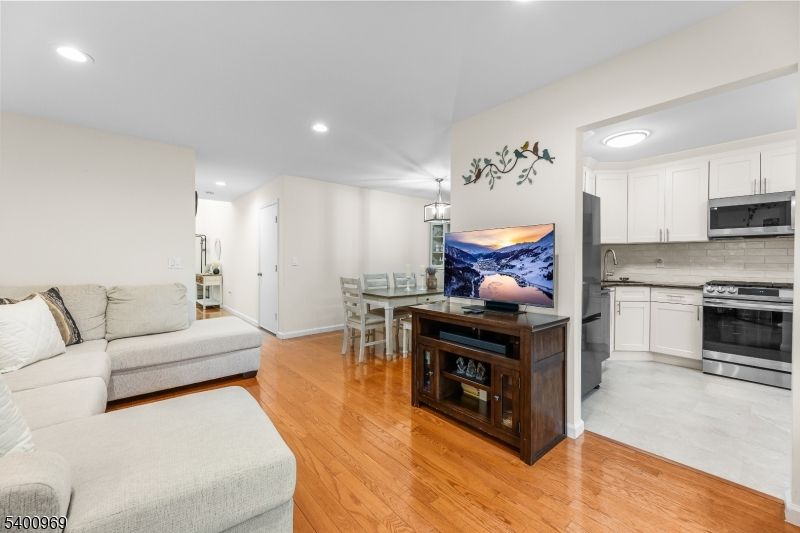 Dining room, Interior, Kitchen, Living room, Pendant Lights, Recessed Lighting, Stainless Steel Appliances, Wood Texture Flooring