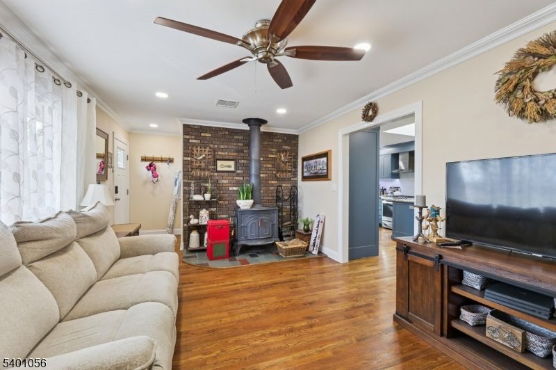 Fireplace, Interior, Kitchen, Living room, Recessed Lighting, Stone Walls, Wood Texture Flooring