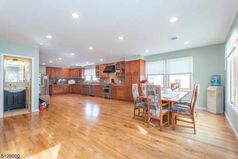 Dining room, Interior, Kitchen, Recessed Lighting, Stainless Steel Appliances, Wood Texture Flooring