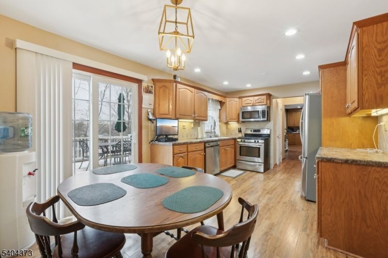 Dining room, Interior, Kitchen, Pendant Lights, Recessed Lighting, Stainless Steel Appliances, Wood Texture Flooring