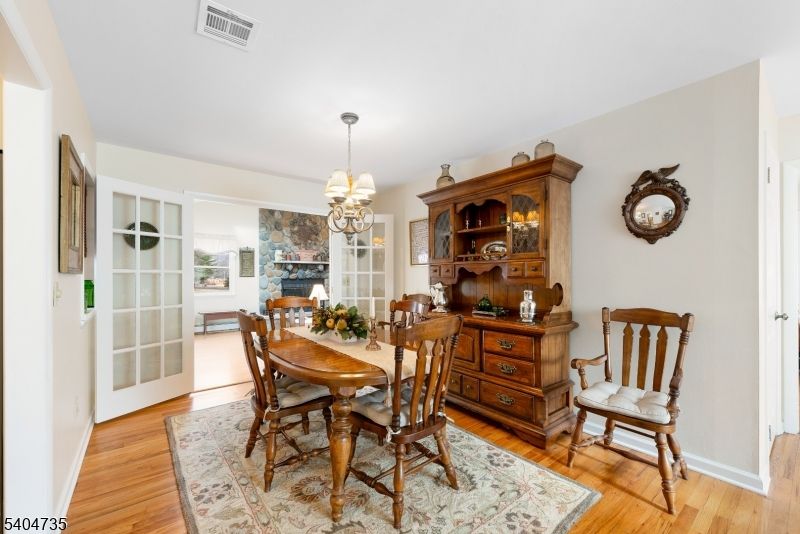 Chandelier, Dining room, Fireplace, Interior, Pendant Lights, Wood Texture Flooring