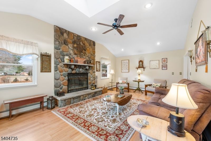 Fireplace, Interior, Living room, Recessed Lighting, Stone Walls, Wood Texture Flooring