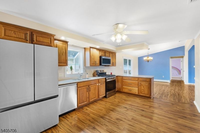 Chandelier, Interior, Kitchen, Recessed Lighting, Stainless Steel Appliances, Wood Texture Flooring