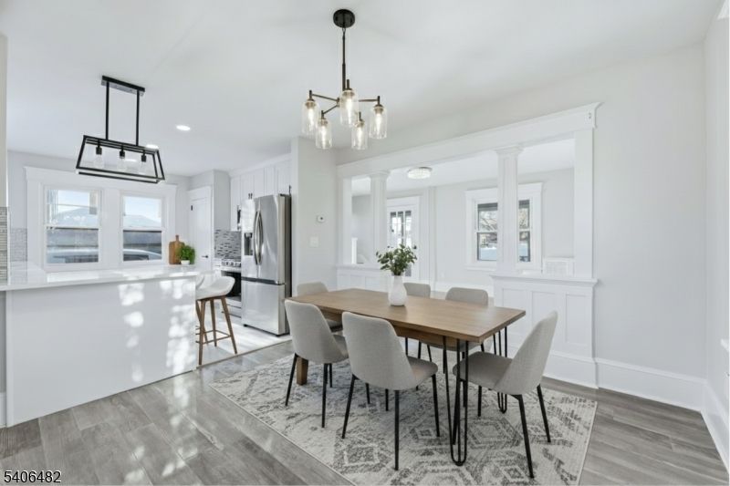 Dining room, Interior, Kitchen, Pendant Lights, Recessed Lighting, Stainless Steel Appliances, Wood Texture Flooring