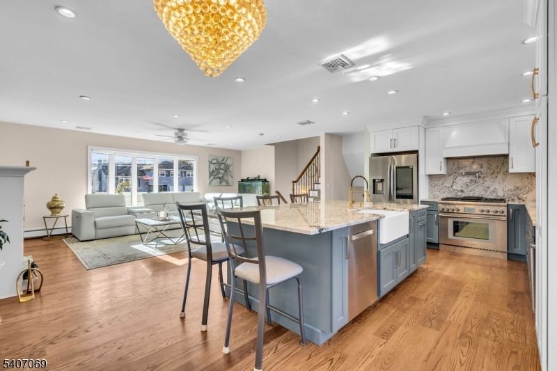 Chandelier, Dining room, Interior, Kitchen, Living room, Recessed Lighting, Stainless Steel Appliances, Wood Texture Flooring