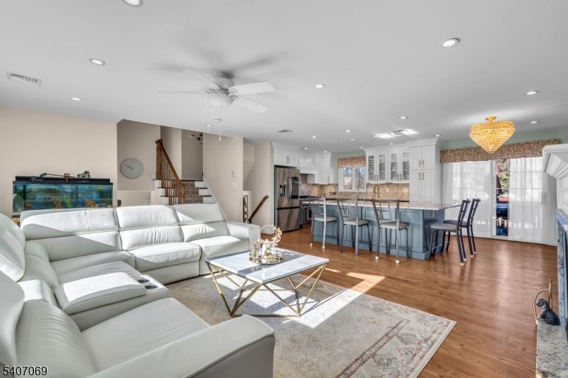 Chandelier, Dining room, Interior, Kitchen, Living room, Recessed Lighting, Stainless Steel Appliances, Wood Texture Flooring