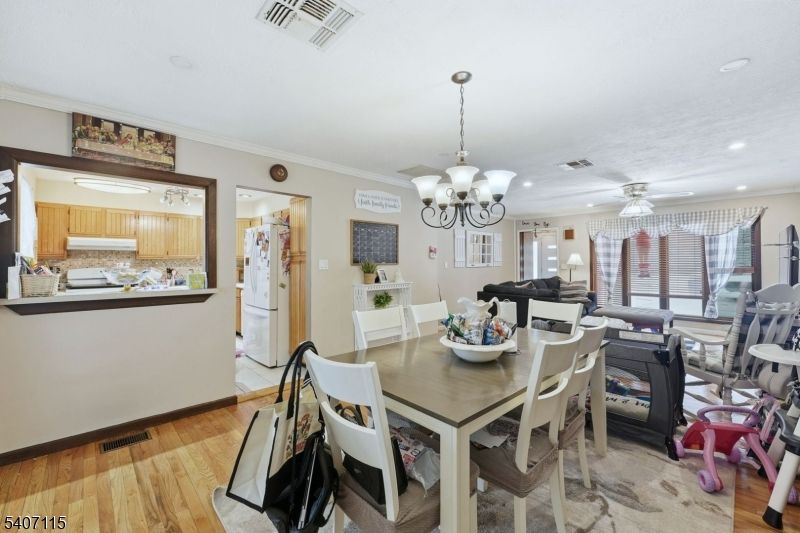 Chandelier, Dining room, Interior, Kitchen, Living room, Recessed Lighting, Wood Texture Flooring