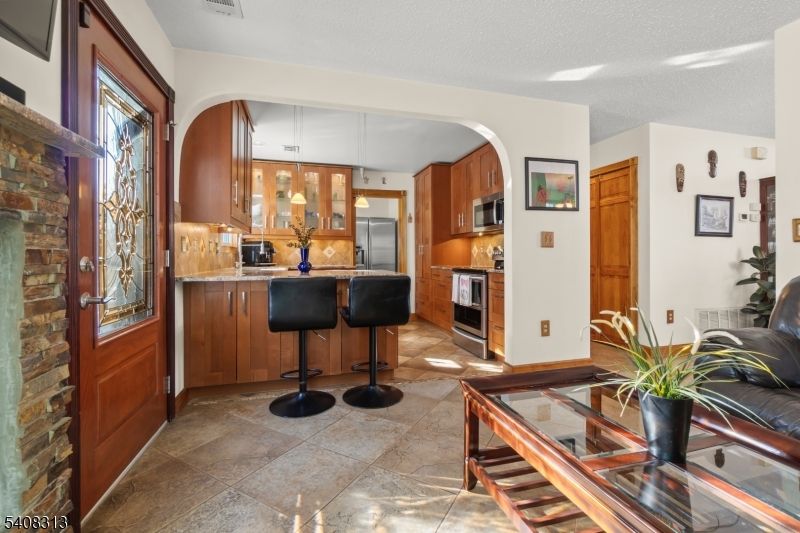 Interior, Kitchen, Pendant Lights, Stainless Steel Appliances, Stone Walls