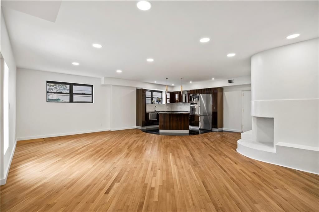 Empty room, Interior, Kitchen, Pendant Lights, Recessed Lighting, Stainless Steel Appliances, Wood Texture Flooring