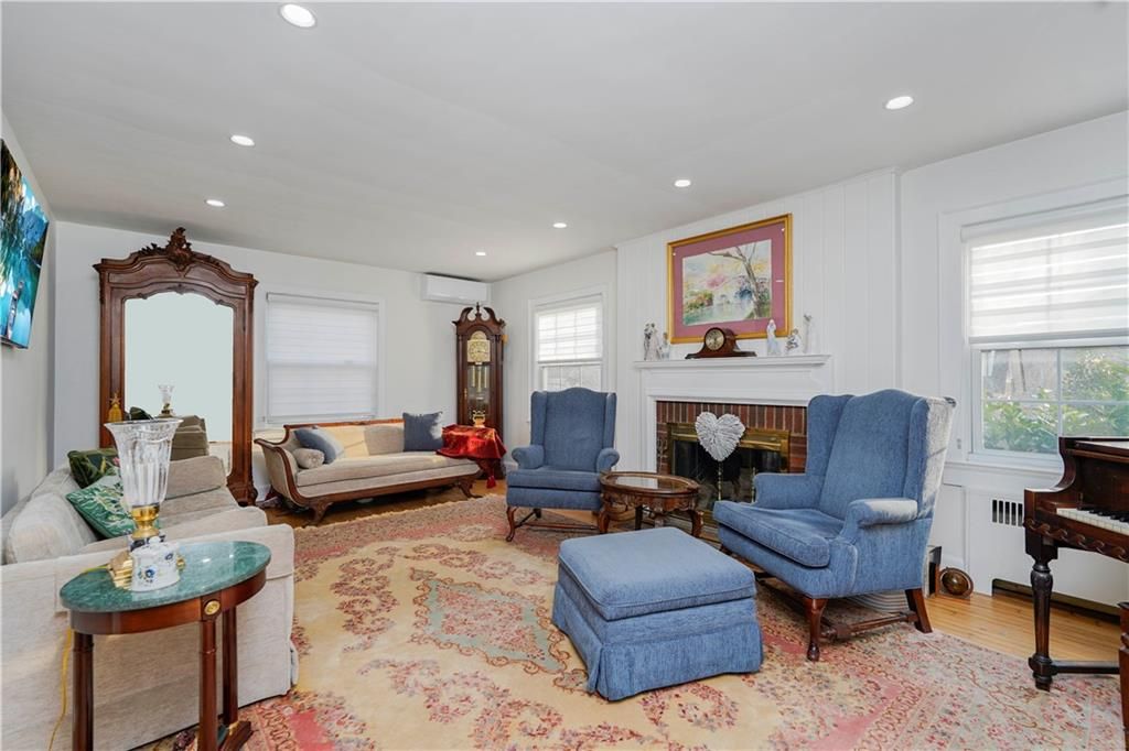 Fireplace, Interior, Living room, Piano, Recessed Lighting, Wood Texture Flooring