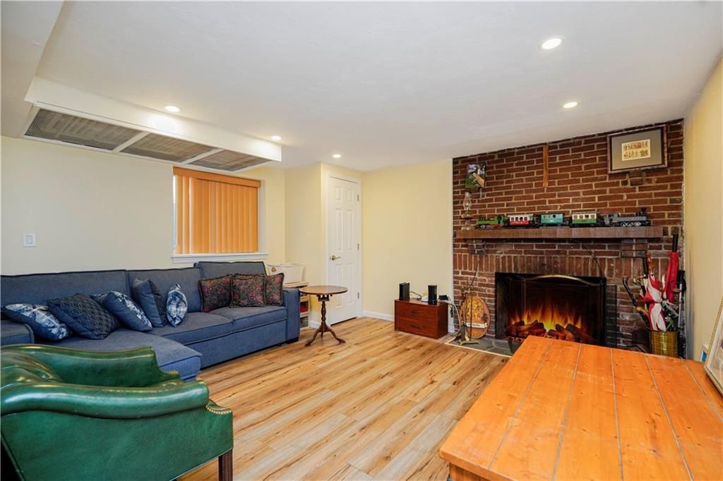 Fireplace, Interior, Living room, Recessed Lighting, Stone Walls, Wood Texture Flooring