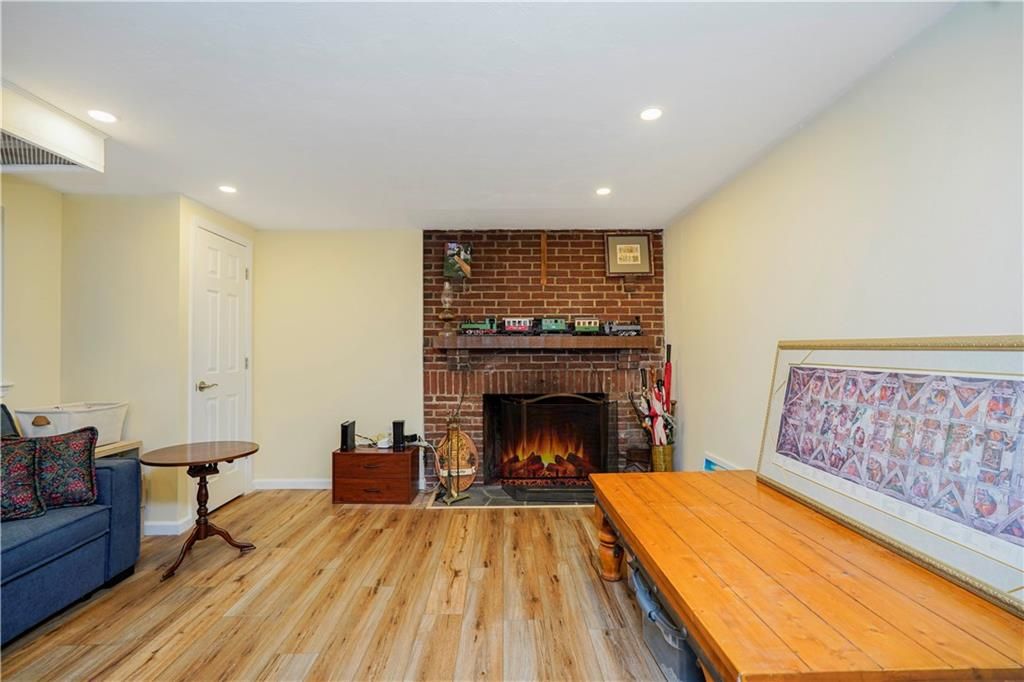 Fireplace, Interior, Recessed Lighting, Stone Walls, Wood Texture Flooring