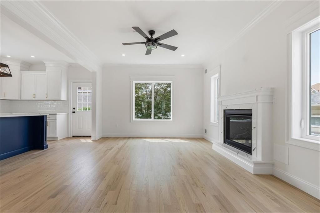 Empty room, Fireplace, Interior, Kitchen, Recessed Lighting, Wood Texture Flooring