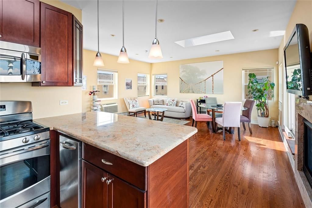 Dining room, Fireplace, Interior, Kitchen, Living room, Pendant Lights, Recessed Lighting, Stainless Steel Appliances, Wood Texture Flooring