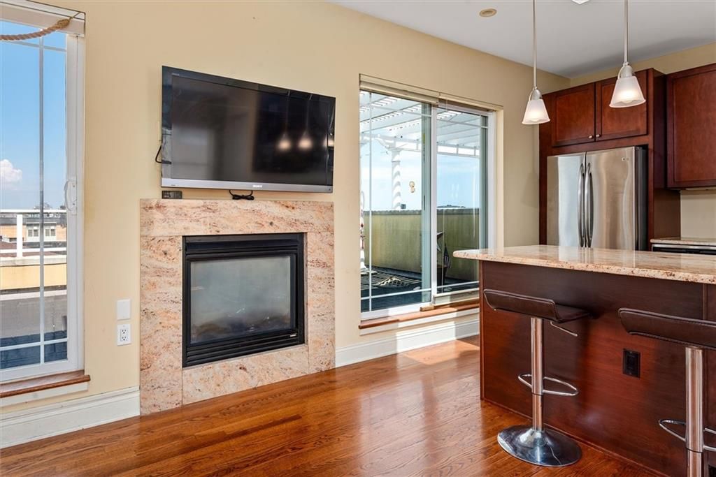 Fireplace, Interior, Kitchen, Pendant Lights, Recessed Lighting, Stainless Steel Appliances, Wood Texture Flooring