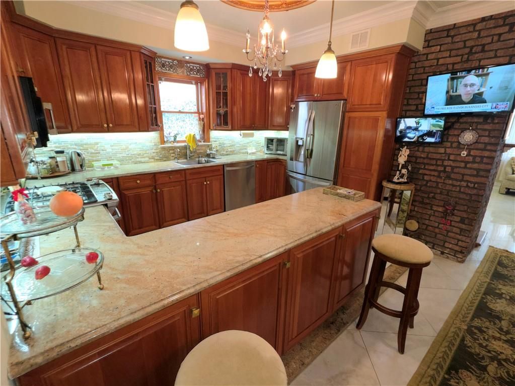 Chandelier, Interior, Kitchen, Pendant Lights, Stainless Steel Appliances, Stone Walls