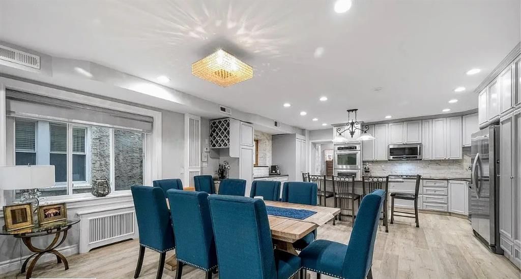 Chandelier, Dining room, Interior, Kitchen, Pendant Lights, Recessed Lighting, Stainless Steel Appliances, Wood Texture Flooring