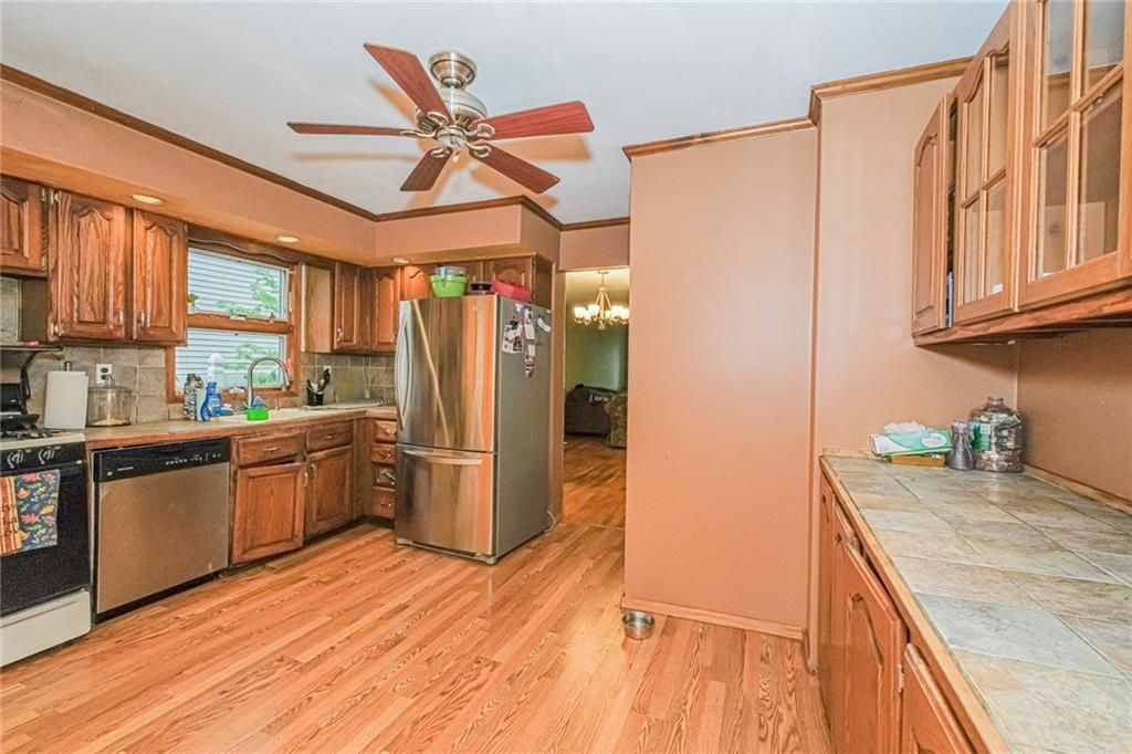 Interior, Kitchen, Recessed Lighting, Tile Countertops, Wood Texture Flooring