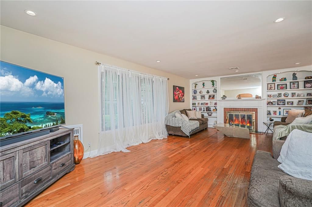 Fireplace, Interior, Living room, Recessed Lighting, Water, Wood Texture Flooring