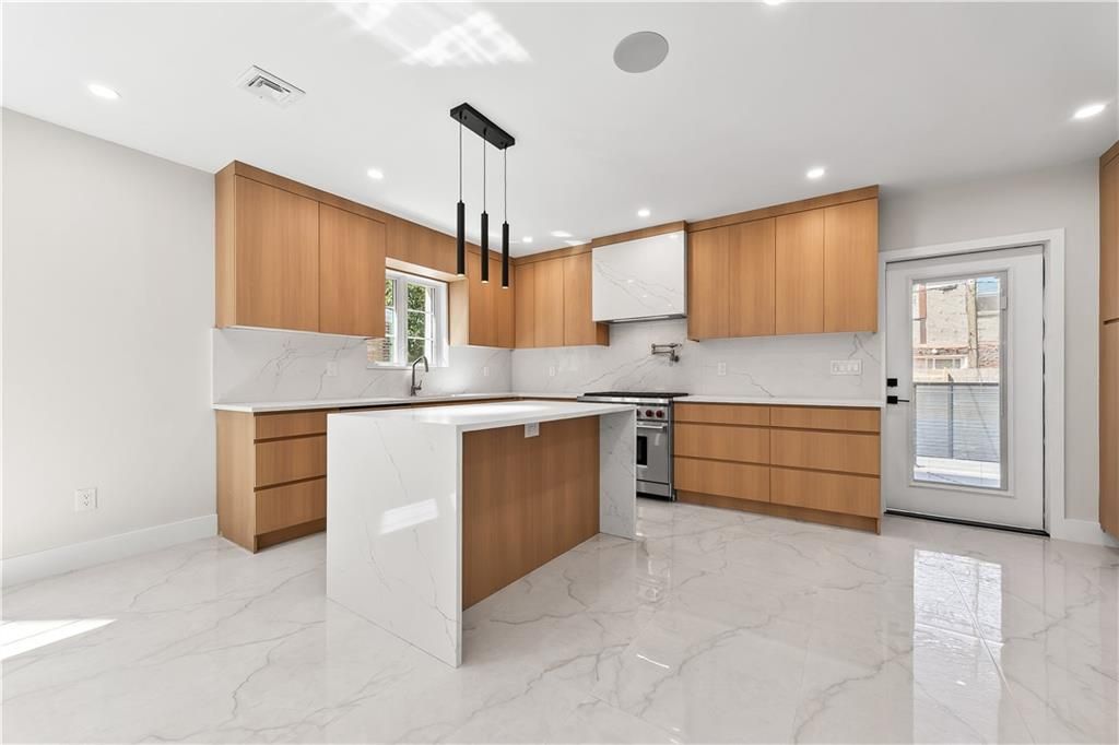 Interior, Kitchen, Marble, Marble Walls, Pendant Lights, Recessed Lighting, Stainless Steel Appliances
