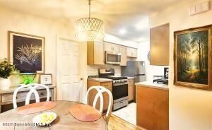 Dining room, Interior, Kitchen, Pendant Lights, Stainless Steel Appliances, Wood Texture Flooring