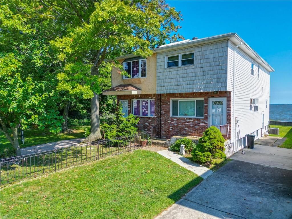 Exterior, Facade, Brick Facade, Water, Split Level