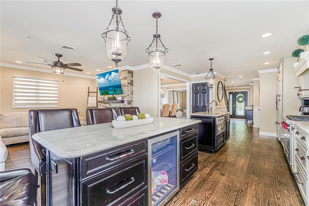 Dining room, Interior, Kitchen, Pendant Lights, Recessed Lighting, Stainless Steel Appliances, Wood Texture Flooring