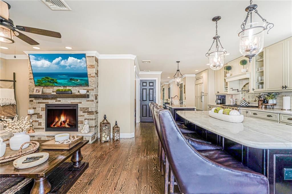 Dining room, Fireplace, Interior, Kitchen, Pendant Lights, Recessed Lighting, Water, Wood Texture Flooring