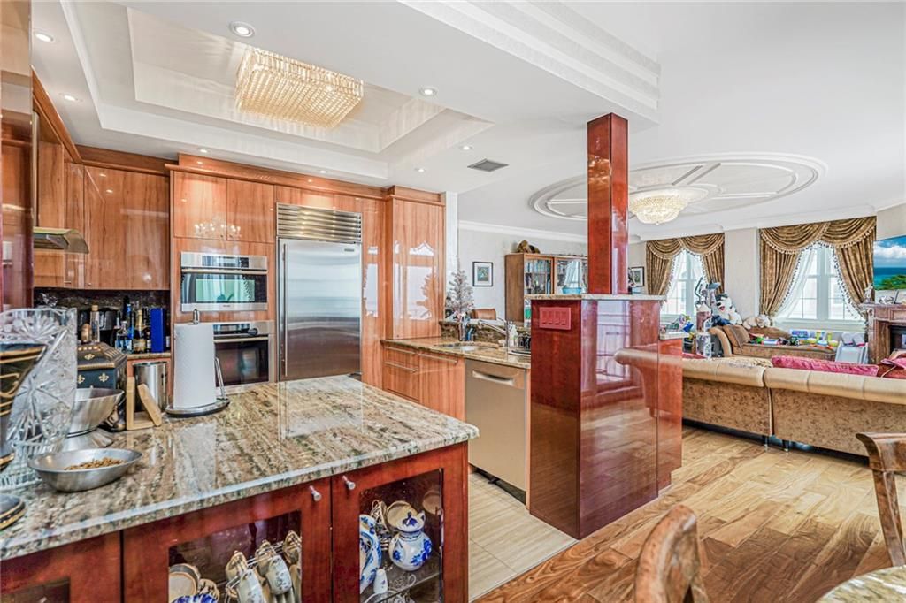 Chandelier, Interior, Kitchen, Living room, Recessed Lighting, Stainless Steel Appliances, Wood Texture Flooring