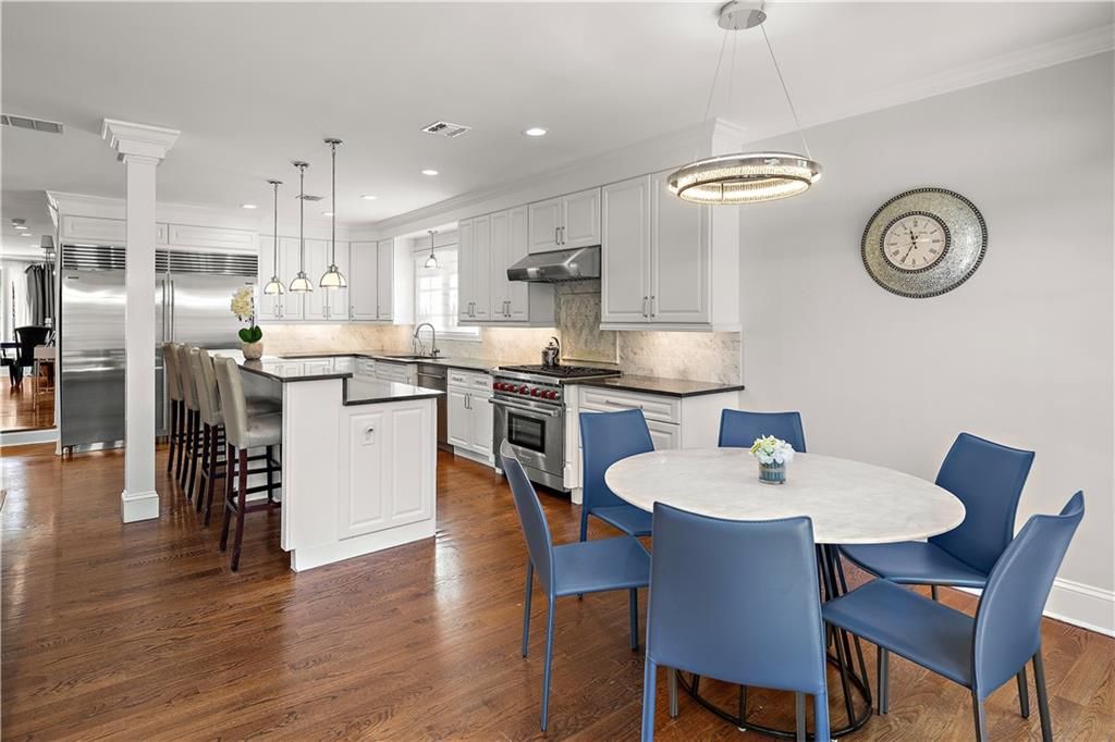 Dining room, Interior, Kitchen, Pendant Lights, Recessed Lighting, Stainless Steel Appliances, Wood Texture Flooring