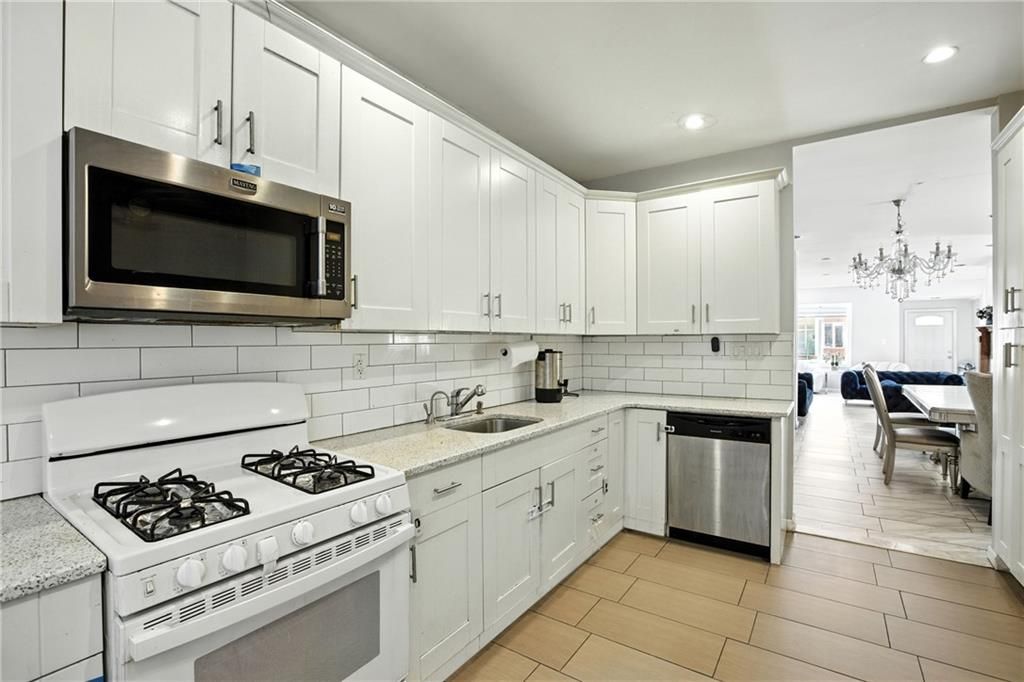 Chandelier, Dining room, Interior, Kitchen, Recessed Lighting, Stainless Steel Appliances, Wood Texture Flooring