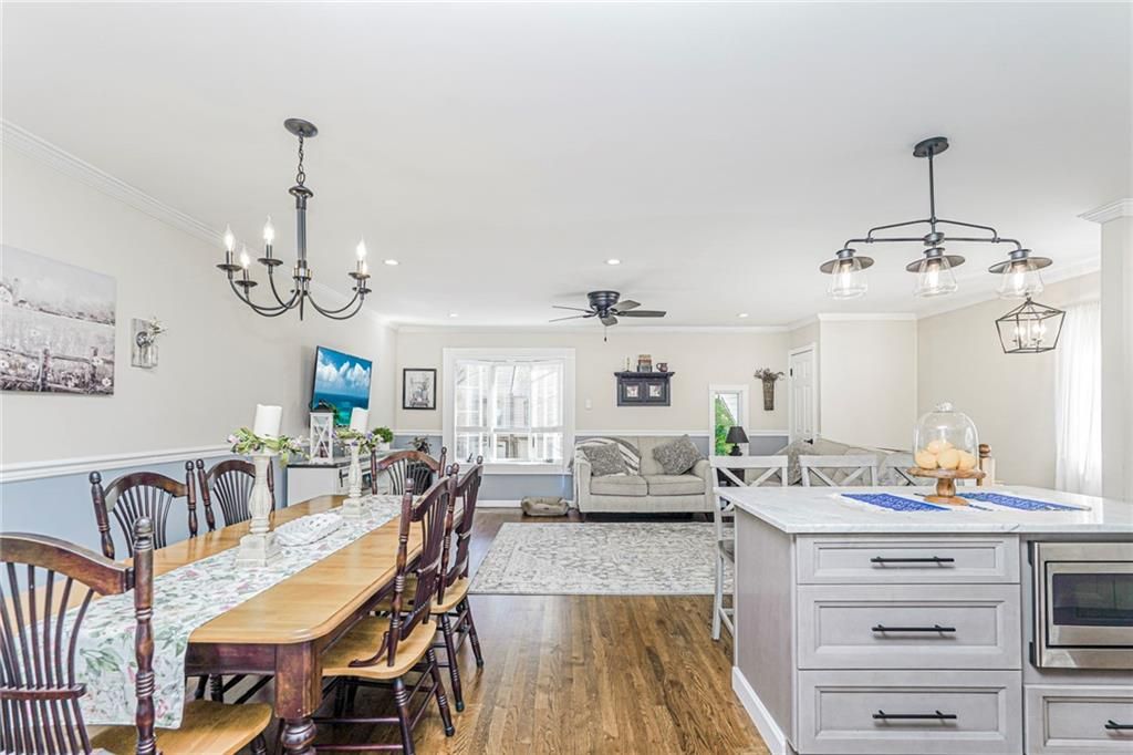 Chandelier, Dining room, Interior, Living room, Pendant Lights, Recessed Lighting, Wood Texture Flooring