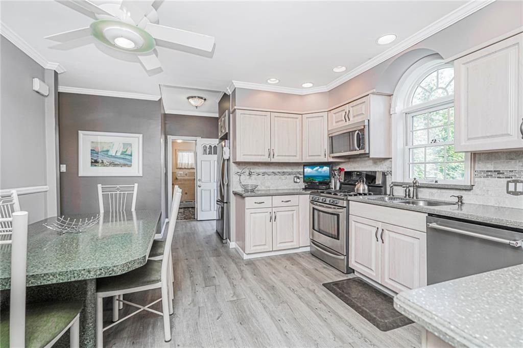 Dining room, Interior, Kitchen, Recessed Lighting, Stainless Steel Appliances, Wood Texture Flooring