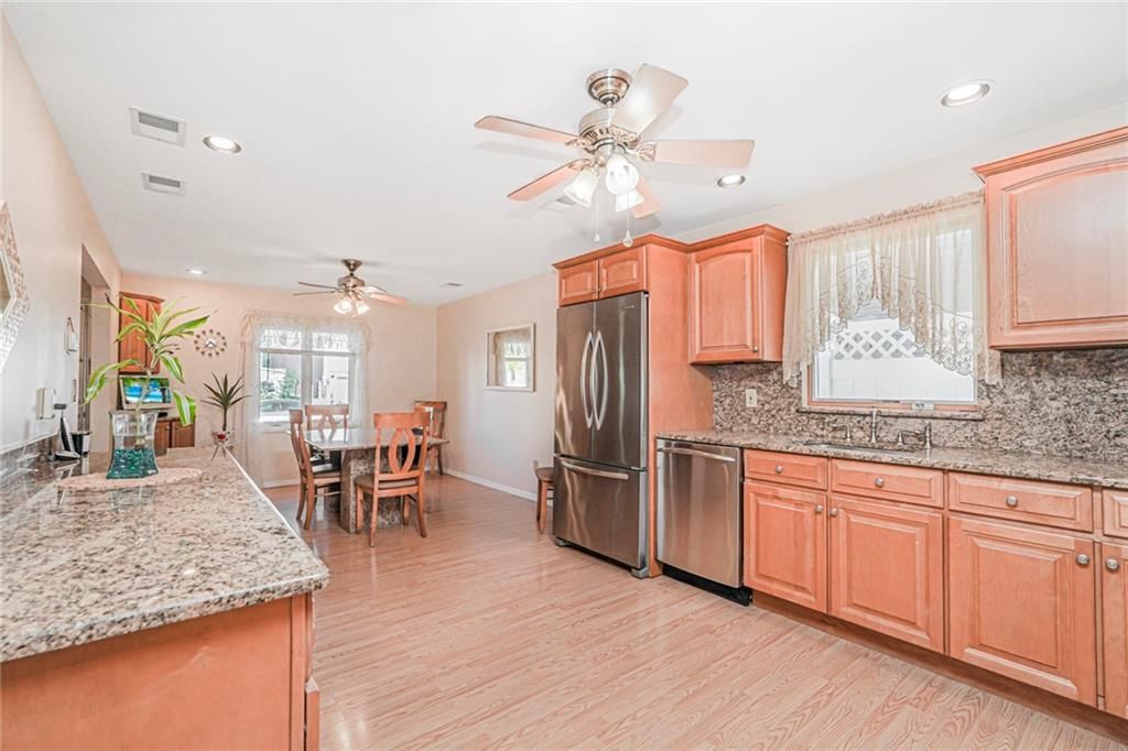 Dining room, Interior, Kitchen, Recessed Lighting, Stainless Steel Appliances, Wood Texture Flooring